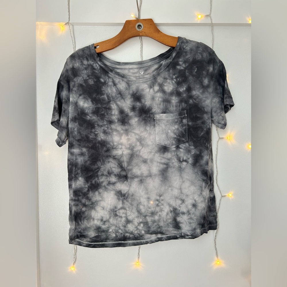A tie dye grey a white shirt